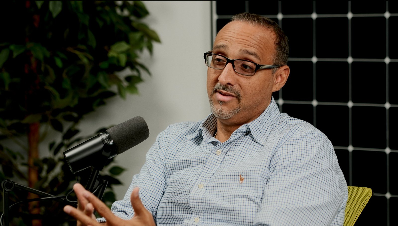 James Whittaker of GreenTech Energy talking to camera in a podcast studio